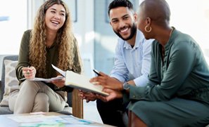 Invisalign patient in Kent smiling with coworkers