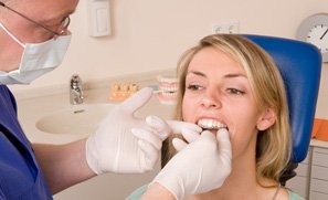 Invisalign patient in Kent smiling with coworkers