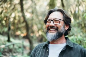 Man with a mini dental implants smiling